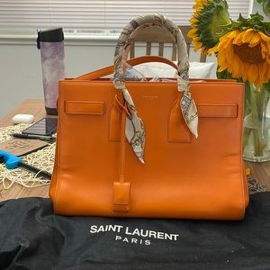 100% authentic Saint Laurent (YSL) orange sac de jour